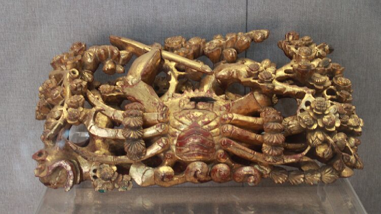 Gold and lacquer wood carvings adorn dwellings in south China