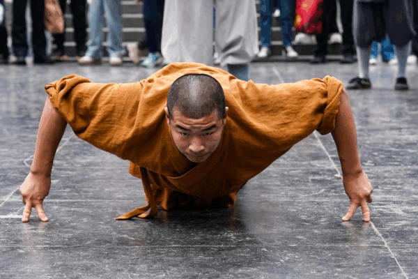 Defying Gravity: Shaolin Monks Perform Amazing Two-Finger Stand Defying gravity: Shaolin monks perform the two-finger stand