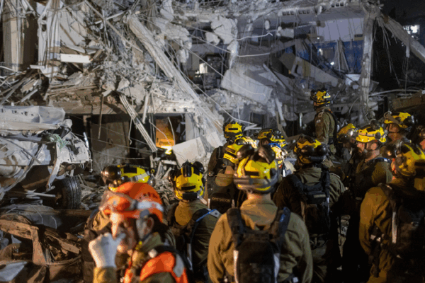 Explosions Shake Israeli Cities After Missile Strikes On the Ground: rubble and debris after Iran missile attack in Israel