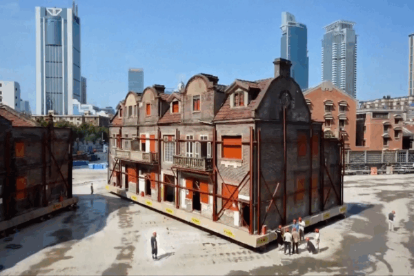 Over 400 Robots Help Historic Shanghai Building Walk Back Home! Over 400 robots help return historic Shanghai complex to original site video poster