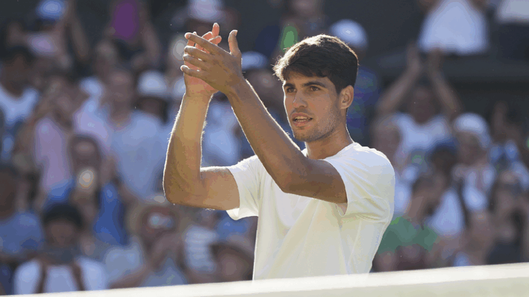 Defending champion Alcaraz labors to first round victory at Wimbledon